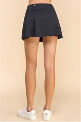 Black tiered tennis skort with built in shorts front and back zipper pink peach boutique