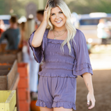 matching short set with ruffle trim on shorts and sleeves smock top pockets in shorts color plumb