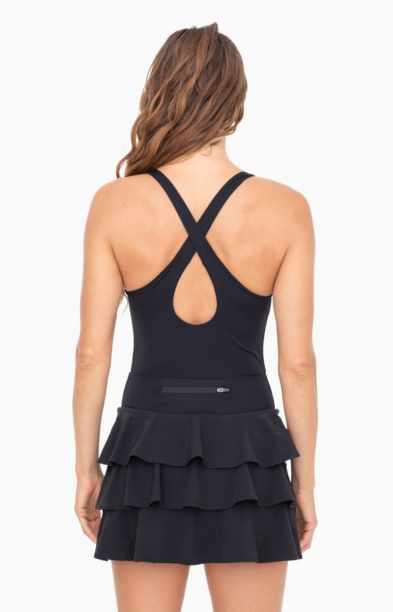 Black ruffle bottom tennis dress with built in shorts cross cross back detail and tiered ruffle back detail discreet back zipper. 